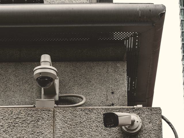 Security cameras mounted on the exterior of a downtown building