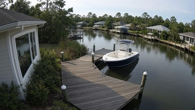 Demo camera view of a private boat dock on a canal